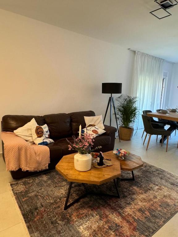 Living room with leather sofa and dining area